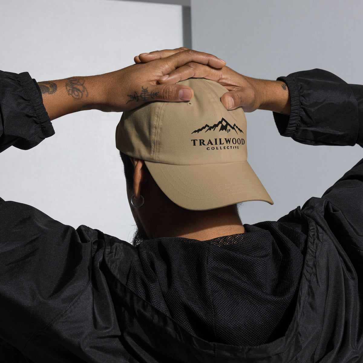 Khaki Trailwood Mountain dad hat, front view of the embroidered logo